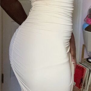 White bodycon dress with ruched detailing, perfect for a night out #bodycon